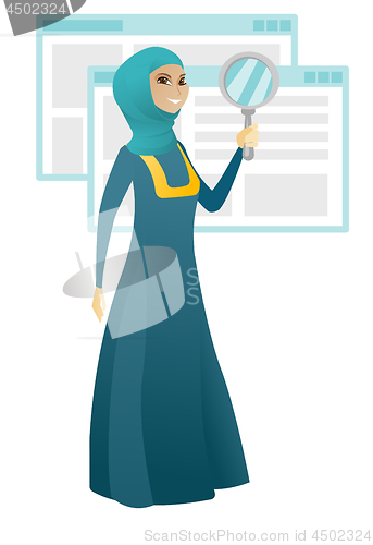 Image of Muslim business woman with magnifying glass.