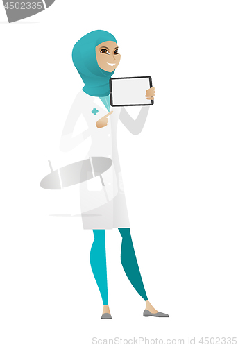 Image of Smiling doctor holding tablet computer.