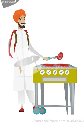 Image of Traveler man cooking steak on barbecue grill.