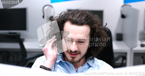 Image of male call centre operator doing his job