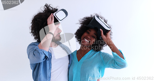 Image of multiethnic couple getting experience using VR headset glasses