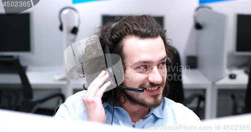 Image of male call centre operator doing his job