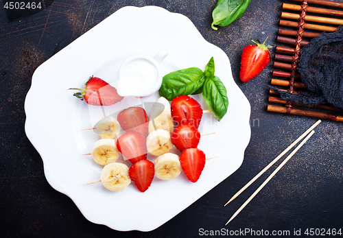Image of banana with strawberry