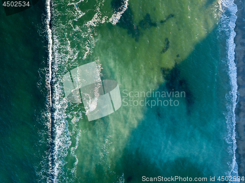 Image of Ocean waves color of turquoise. Marine natural seascape background. Top view aerial from drone. Copy space.