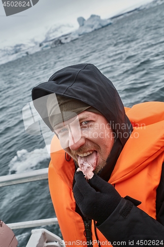 Image of Glacier lagoon in Iceland, tasting ice pieces