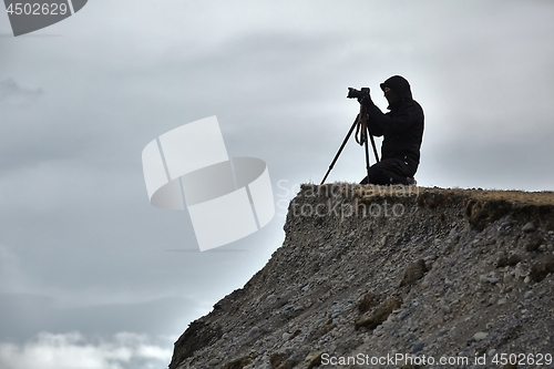 Image of Photographer with tripod