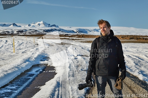 Image of Landscape photographer in Iceland. The journey begins where the road ends