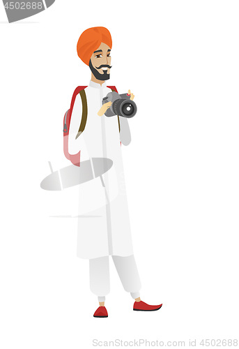 Image of Hindu nature photographer with digital camera.