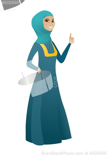 Image of Young muslim business woman giving thumb up.
