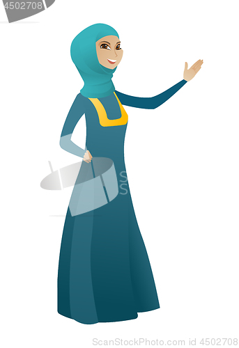 Image of Muslim business woman showing a direction.