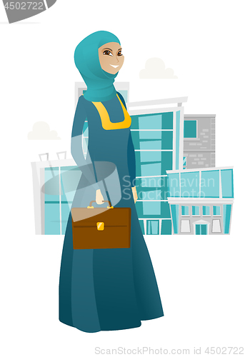 Image of Muslim business woman holding briefcase.