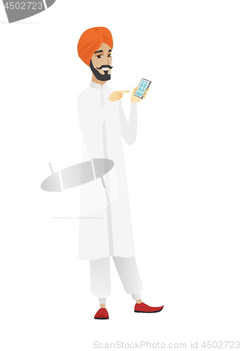 Image of Hindu businessman holding a mobile phone.