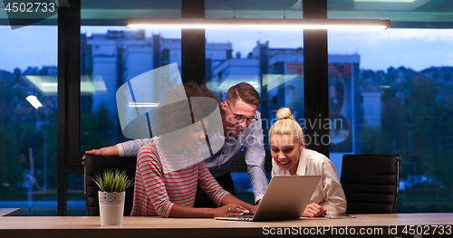 Image of Multiethnic startup business team in night office