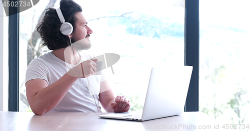 Image of man drinking coffee enjoying relaxing lifestyle