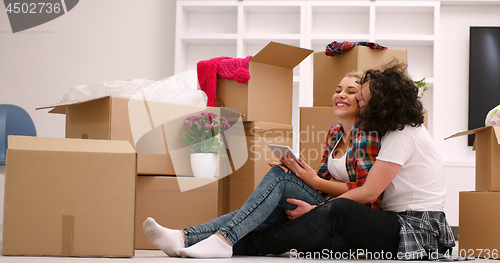 Image of young couple moving  in new house