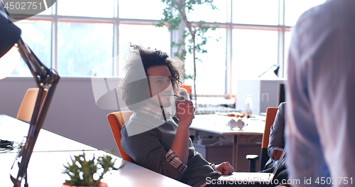 Image of businessman working using a laptop in startup office