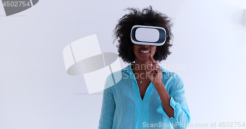 Image of black girl using VR headset glasses of virtual reality