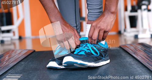 Image of black female feet in sneakers