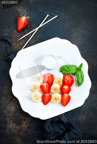 Image of banana with strawberry