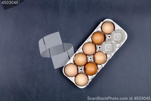 Image of Farm chicken eggs in cardboard container