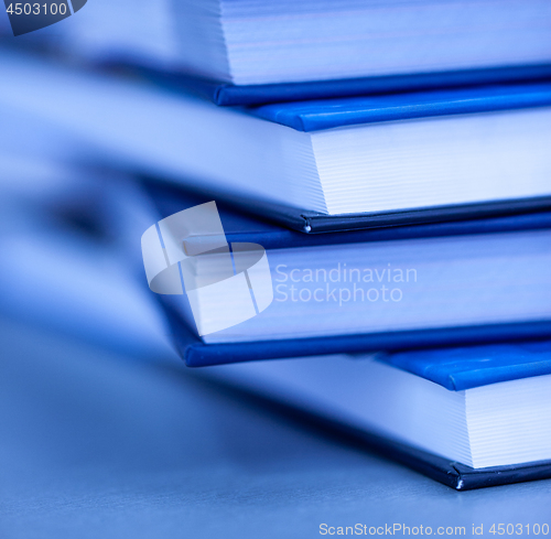 Image of A few books are stacked.