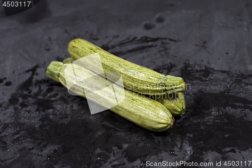 Image of Fresh green wet zucchini.