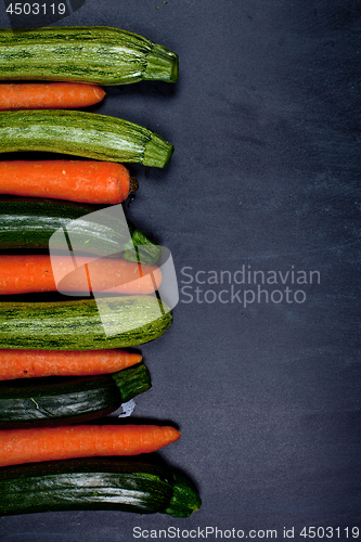 Image of Fresh organic wet carrots and zucchini.