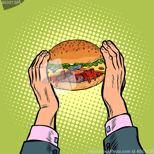 Image of hands holding a Burger. fast food restaurant