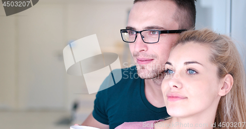 Image of young couple enjoying morning coffee