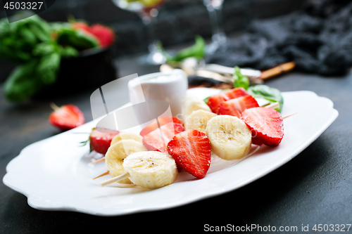 Image of banana with strawberry