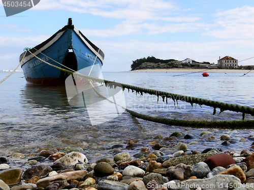 Image of Small Boat in Coastal Scene.