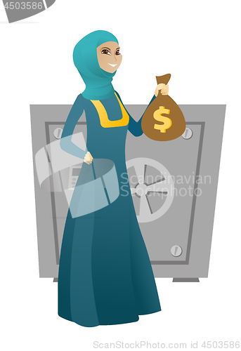 Image of Muslim business woman holding a money bag.