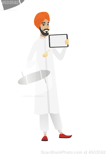 Image of Smiling businessman holding tablet computer.
