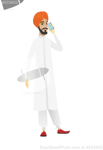 Image of Businessman talking on a mobile phone.