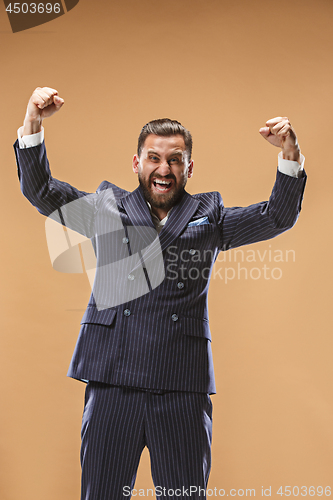 Image of Winning success man happy ecstatic celebrating being a winner. Dynamic energetic image of male model