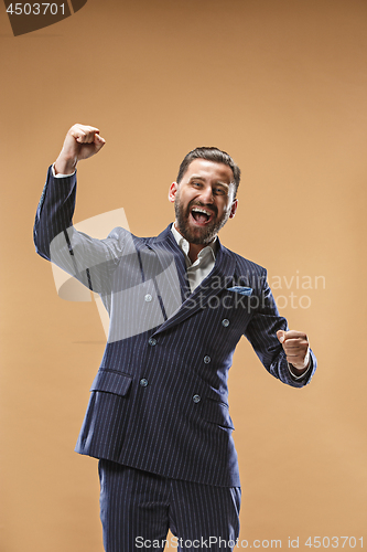 Image of Winning success man happy ecstatic celebrating being a winner. Dynamic energetic image of male model