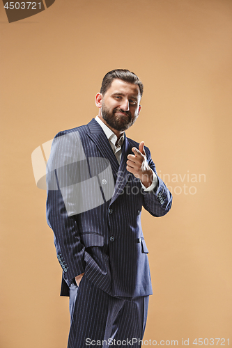 Image of The happy business man point you and want you, half length closeup portrait on pastel background.