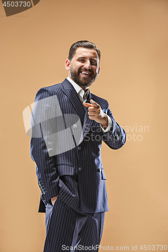 Image of The happy business man point you and want you, half length closeup portrait on pastel background.