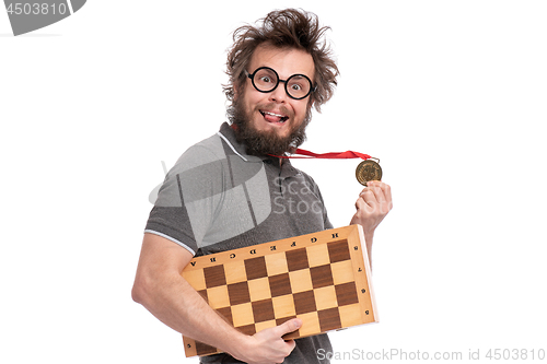 Image of Crazy bearded man with Chess board