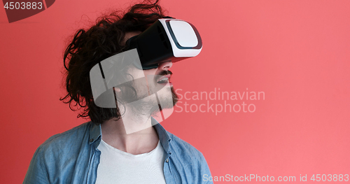 Image of young man using VR headset glasses of virtual reality