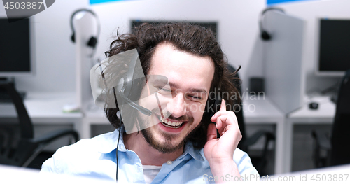 Image of male call centre operator doing his job