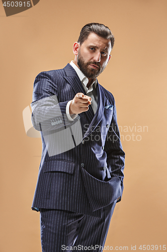 Image of The happy business man point you and want you, half length closeup portrait on pastel background.