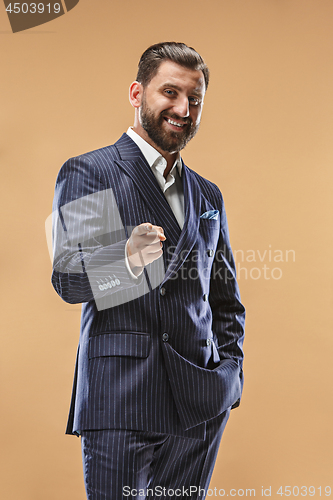 Image of The happy business man point you and want you, half length closeup portrait on pastel background.