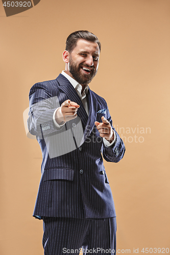 Image of The happy business man point you and want you, half length closeup portrait on pastel background.