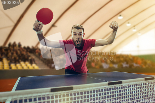 Image of The table tennis player celebrating victory