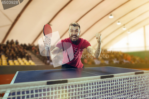 Image of The table tennis player celebrating victory