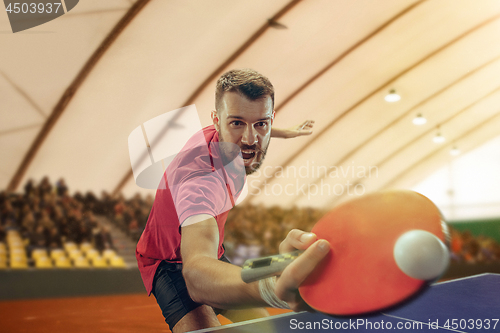 Image of The table tennis player serving