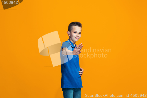 Image of Young serious thoughtful teen boy. Doubt concept.