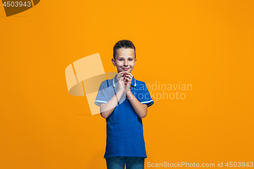 Image of Young serious thoughtful teen boy. Doubt concept.