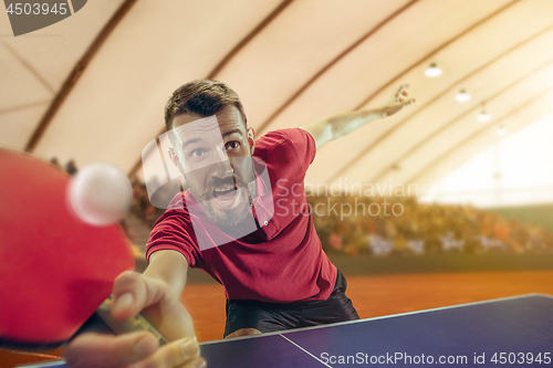 Image of The table tennis player serving